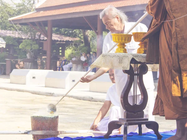 Monk and buddhist melt the gold
