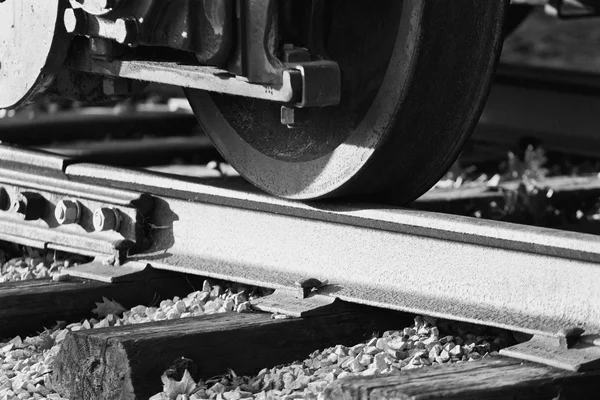 Black and white image with the train wheels