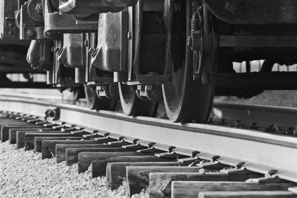 Beautiul black and white image of the train wheels