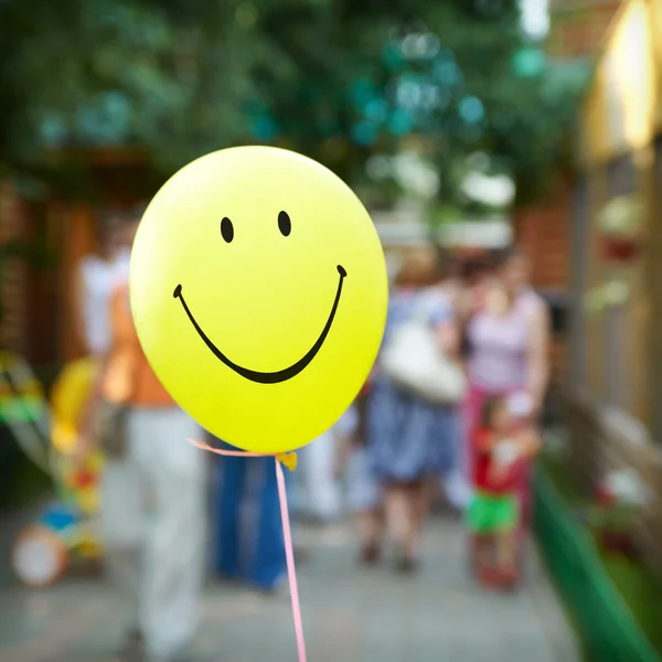 Yellow smiling face balloon