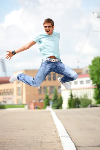 Man jumping at the city street