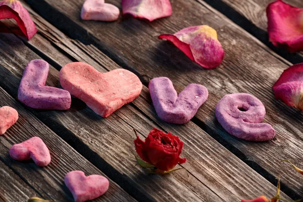 Word Love with rose petals