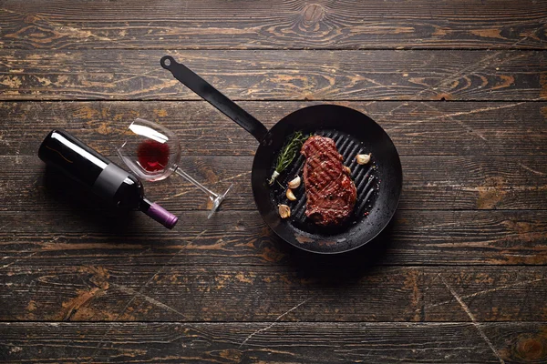 Marbled beef steak with wine bottle
