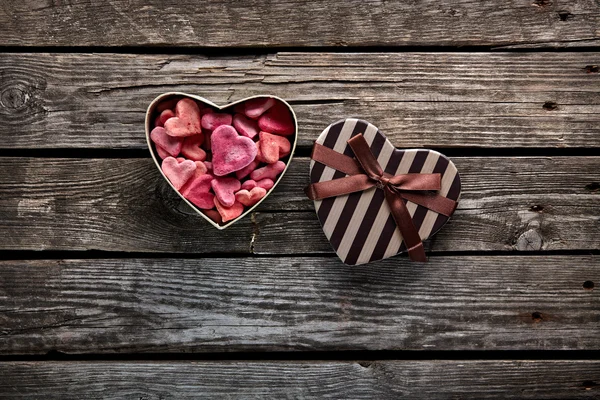 Open heart shaped gift box with hearts