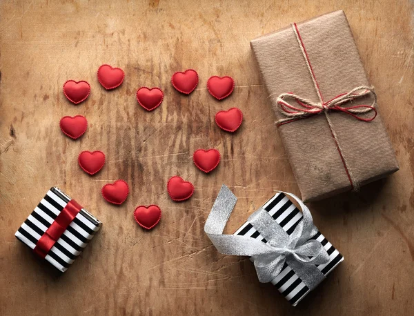 Three gift boxes with small hearts