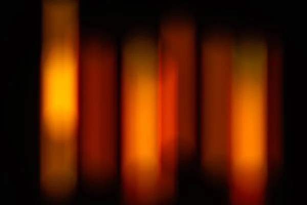 The Defocused abstract orange and black background