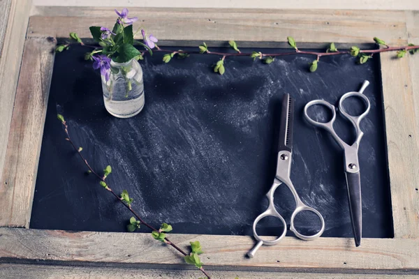 Hair Cutting and Thinning Scissors on vintage background. Hairdresser salon concept. Haircut accessories, flat lay