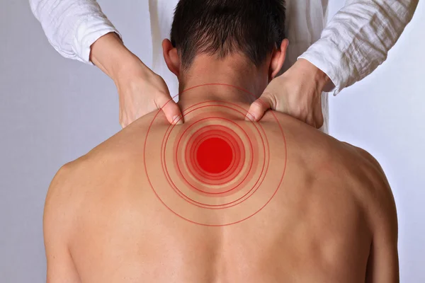 Chiropractic, osteopathy, manual therapy, acupressure. Therapist  doing healing treatment on man\'s back. Alternative medicine, pain relief concept