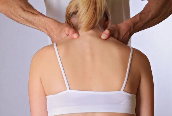 Chiropractic, osteopathy, physical therapy, acupressure. Therapist  doing healing treatment on woman\'s back . Alternative medicine, pain relief concept
