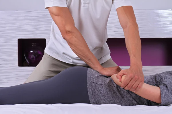 Chiropractic, osteopathy, manual therapy. Therapist doing healing treatment on woman's back . Alternative medicine, physiotherapy, pain relief concept