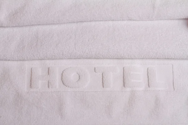 Stack of white  hotel towels. Perfect white laundry. Keep Whites White. Hotel hygiene
