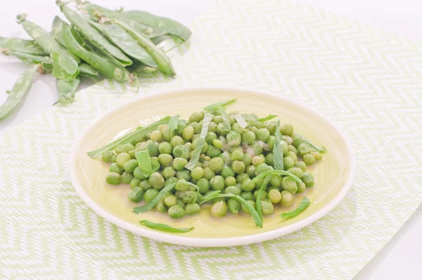 Fresh green peas stews seasoned with mint,italy