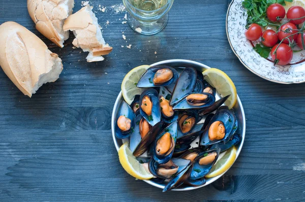 Cooked mussels marinara with tomato, garlic and olive oil