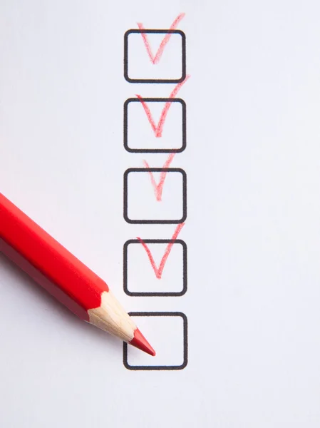 Checklist with red pencil