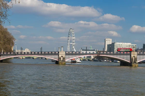 View of London Eye over Lambeth Bridge across River Thames