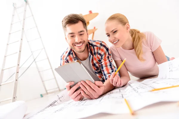 Young couple looking at tablet