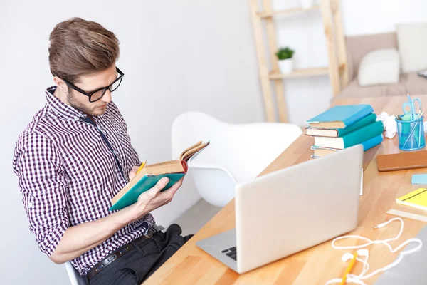 Young guy studying at home