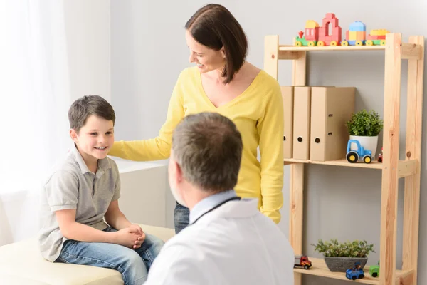 Pediatrician doctor examining child