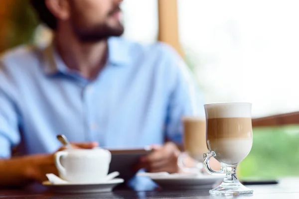 Thoughtful businessman making break in cafeteria