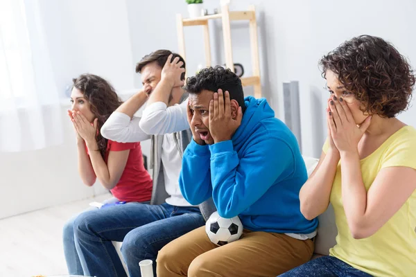 Group of multi national football fans cheering