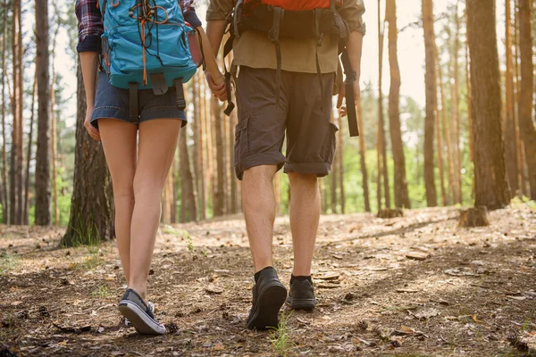 Man and woman traveling in nature