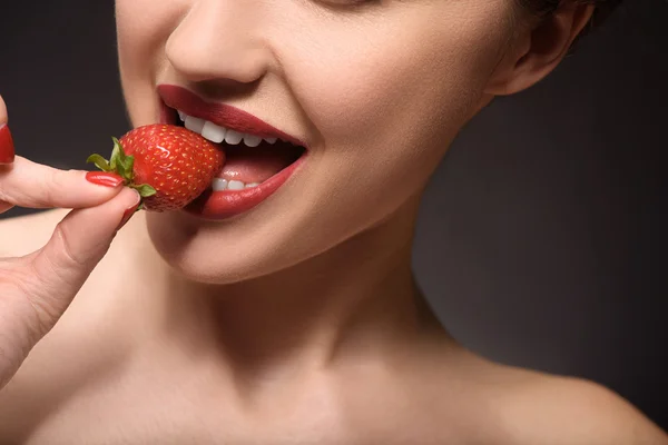 Sexy young woman eating sweet food