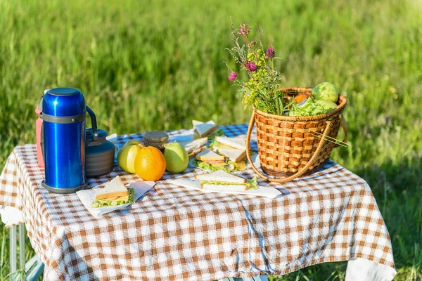 Picnic table loading with summer foods