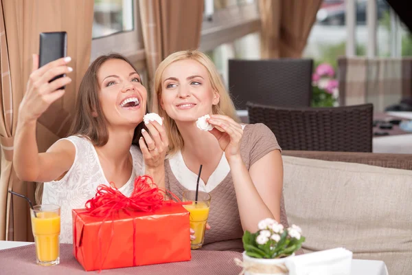 Attractive young women are resting in cafe