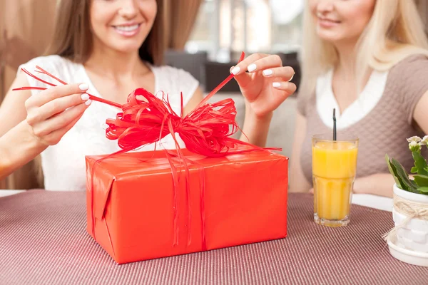 Cute young girls are celebrating in restaurant