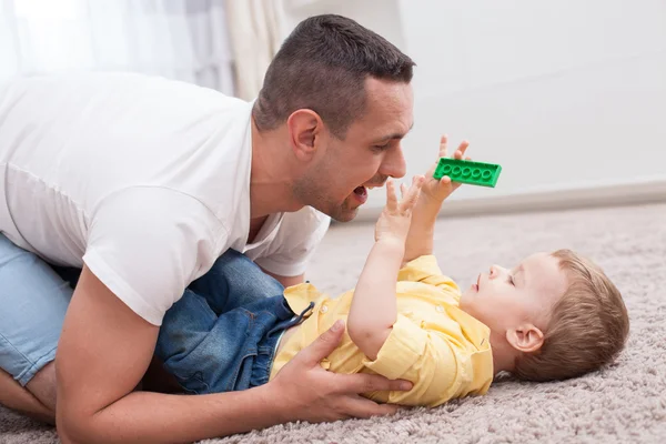 Handsome young father is spending time with his kid