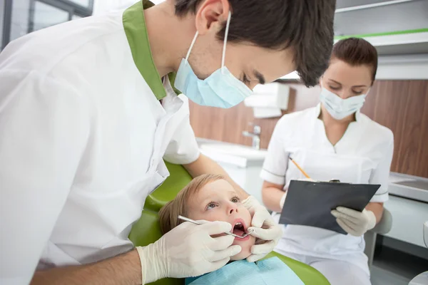 Attractive male dentist is analyzing human health