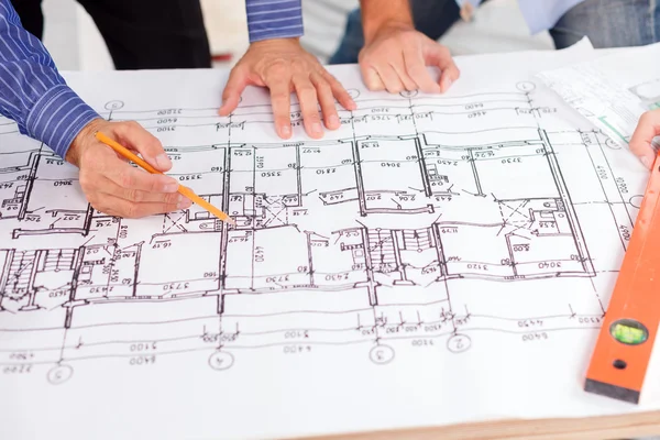 Skillful male engineers are planning new construction