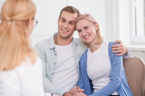 Cute married couple is consulting skillful therapist