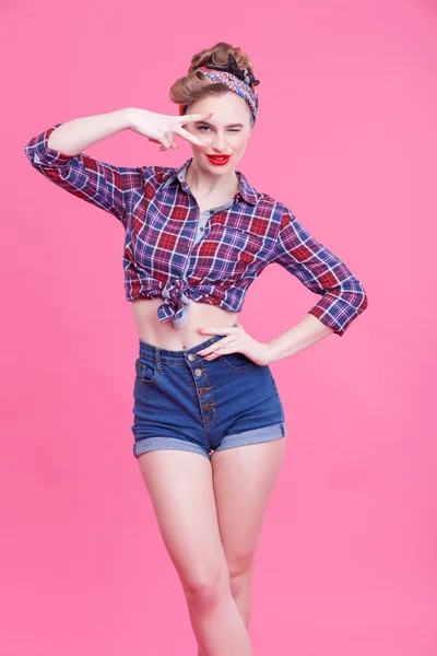 Pretty pin-up girl is evincing her sexuality