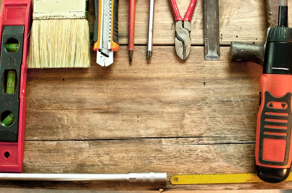Various tools on a wooden floor.