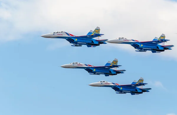 Flight groups of four su-27 aircraft from the aerobatic team Russian Knights at an Airshow in St. Petersburg. July 2015.