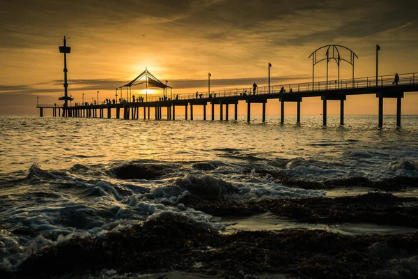 Sunset, jetty and beach