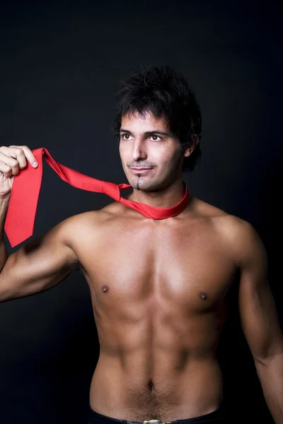 Shirtless man with red tie