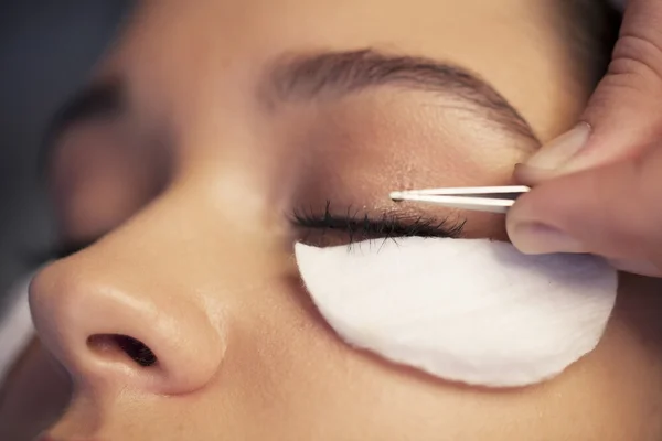 Woman taking care of Eyelashes