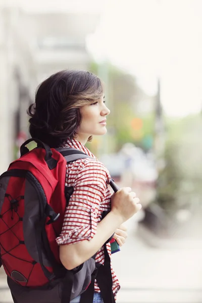 Woman with backpack standing