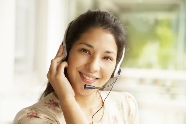 Woman in headset smiling