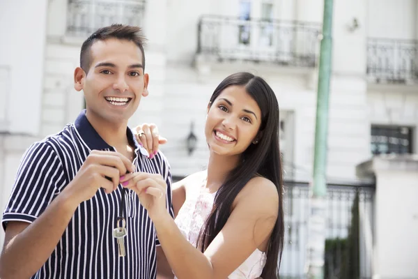 Couple holding keys