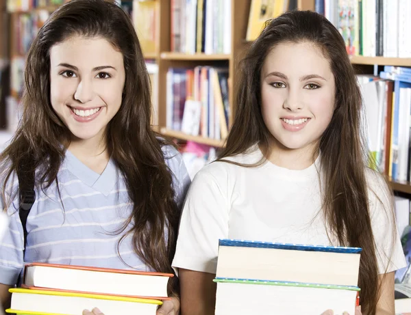 Students holding books