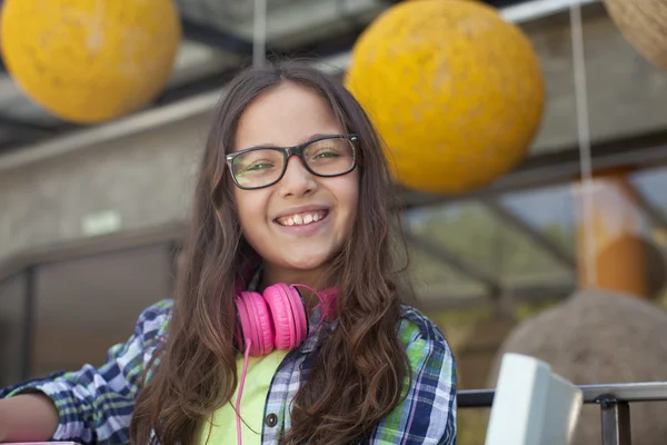 Girl with headphones smiling