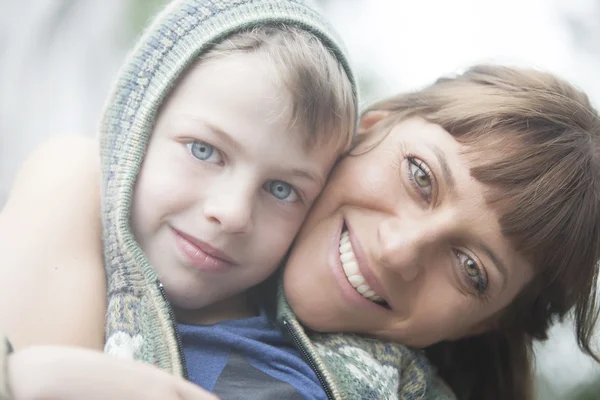 Mother hugging son