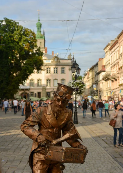 Beautiful summer view of the Market Square in Lviv, a living sculpture in the center of the frame. July 2016 year.