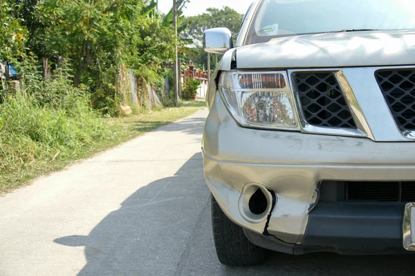 A dent on the right front of a pickup truck