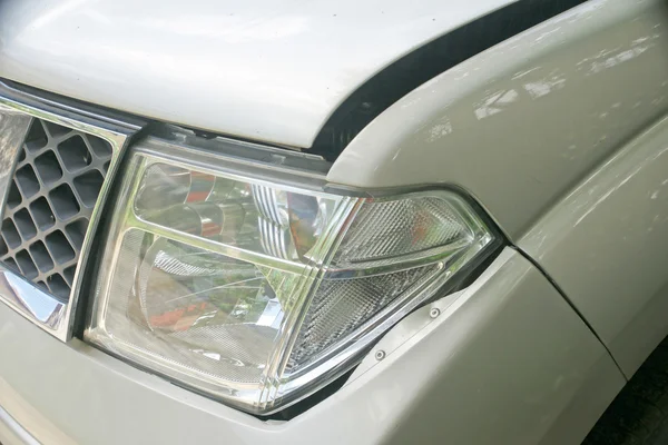 A dent on the left front of a pickup truck (damage from crash accident)