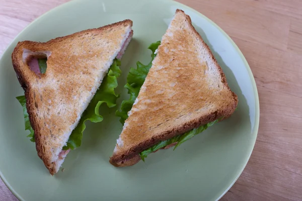 Two of toast with salad on a plate