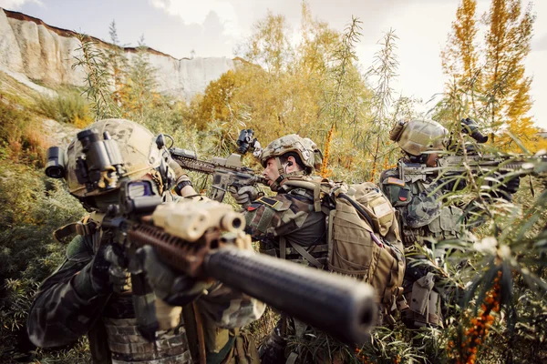 Solders aiming at a target of weapons